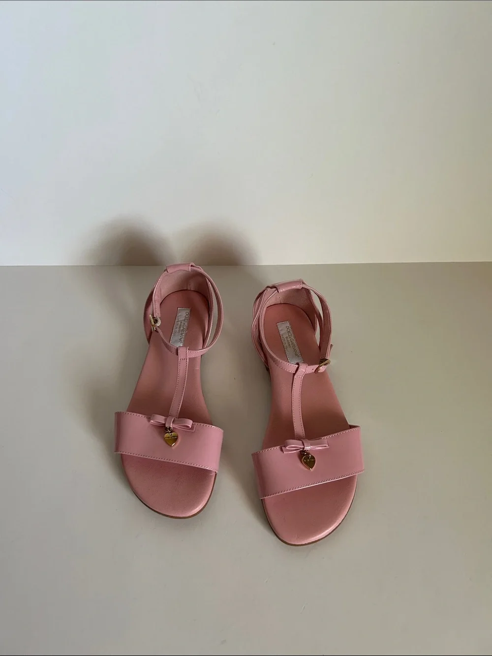 Dolce & Gabbana Pink T-Strap Sandals with Bow and Gold Heart
